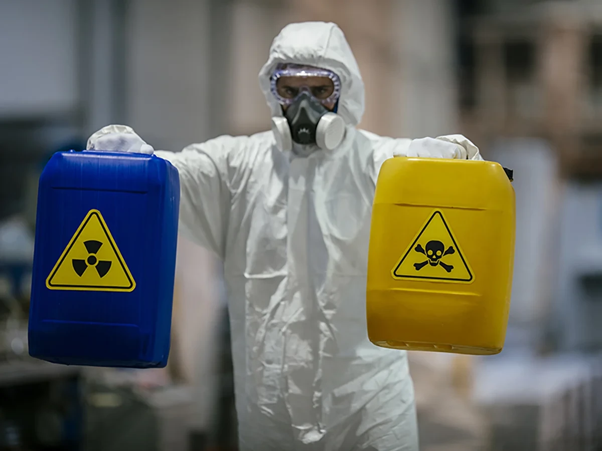 Biohazard cleanup technicians in protective equipment at a remediation scene in Seattle, WA